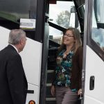 Badder Bus driver greets a departing passenger